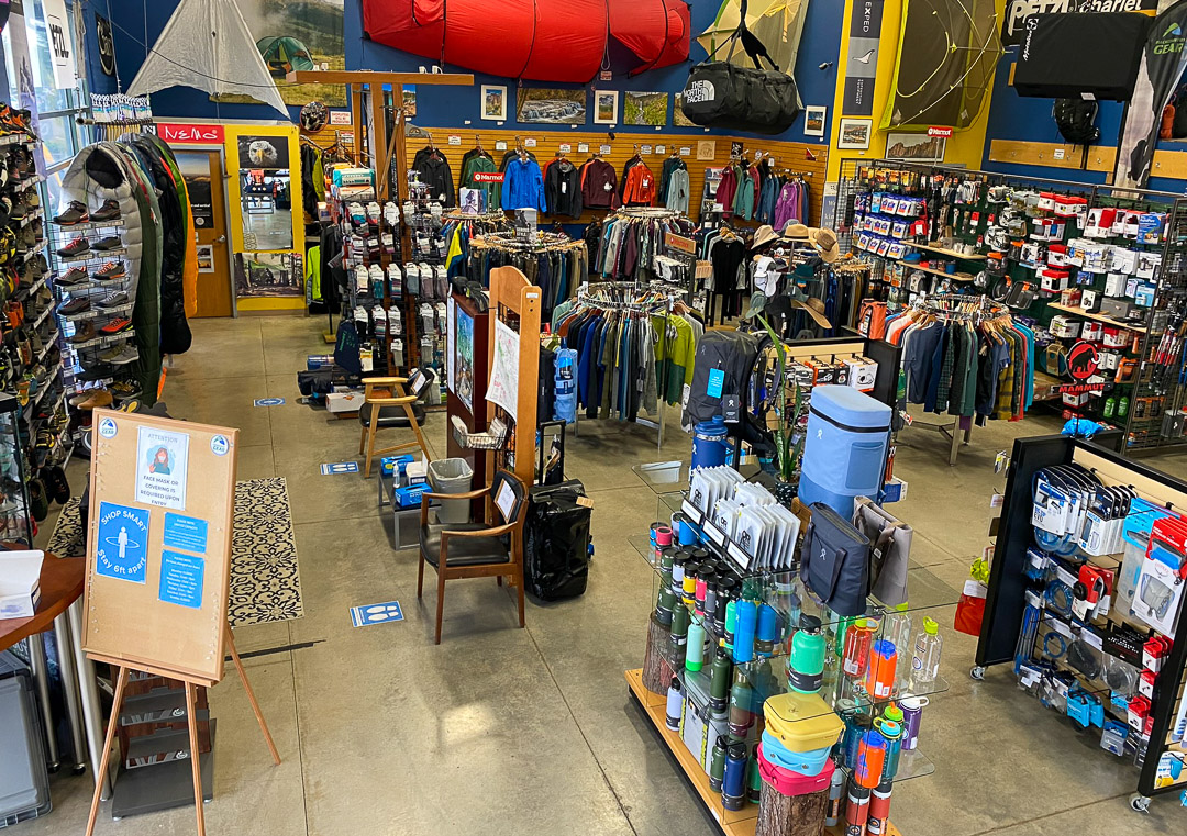 inside of a retail store containing outdoor products, clothing and accessories